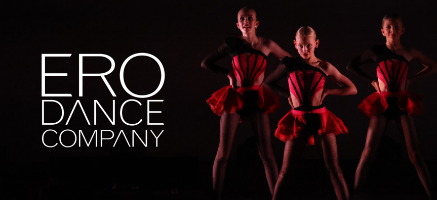 Three young dancers pose on stage