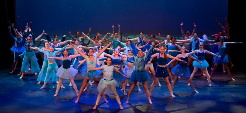 Young dancers celebrate on stage